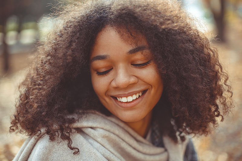 young woman thinking about her dental care